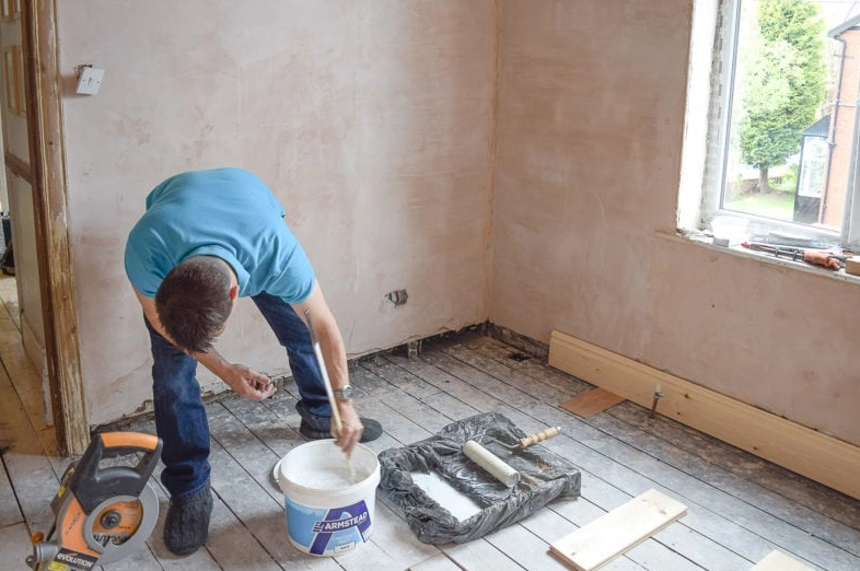 To strip paint from a wall you can use a chemical paint stripper or a heat gun.