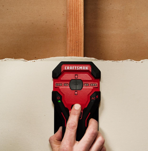 an image of a red craftsman cable detector against wall