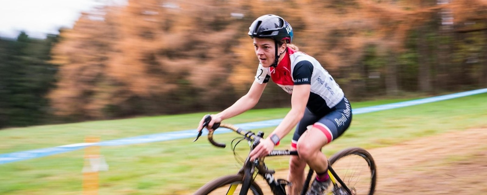 Bikeability volunteer Hayley racing on a bike on a trail