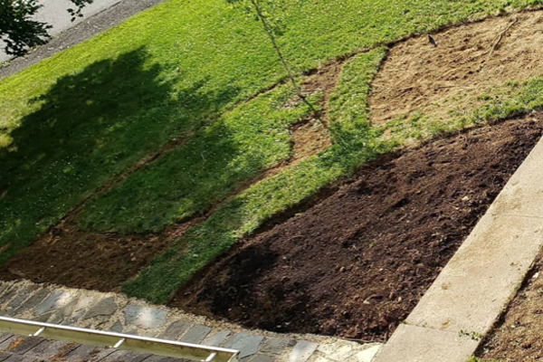 an image of removed turf outside a home and in the garden