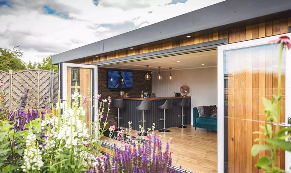 A Spa-retreat garden shed bar can be done in the garden with hot tubs, face masks, and smoothies in the fridge.