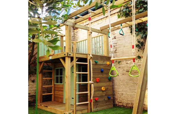 Childrens play area made from garden decking. Outdoor wooden play area with stairs and monkey bars all made from Timber. 