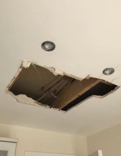 an image of a hole in plasterboard ceiling 