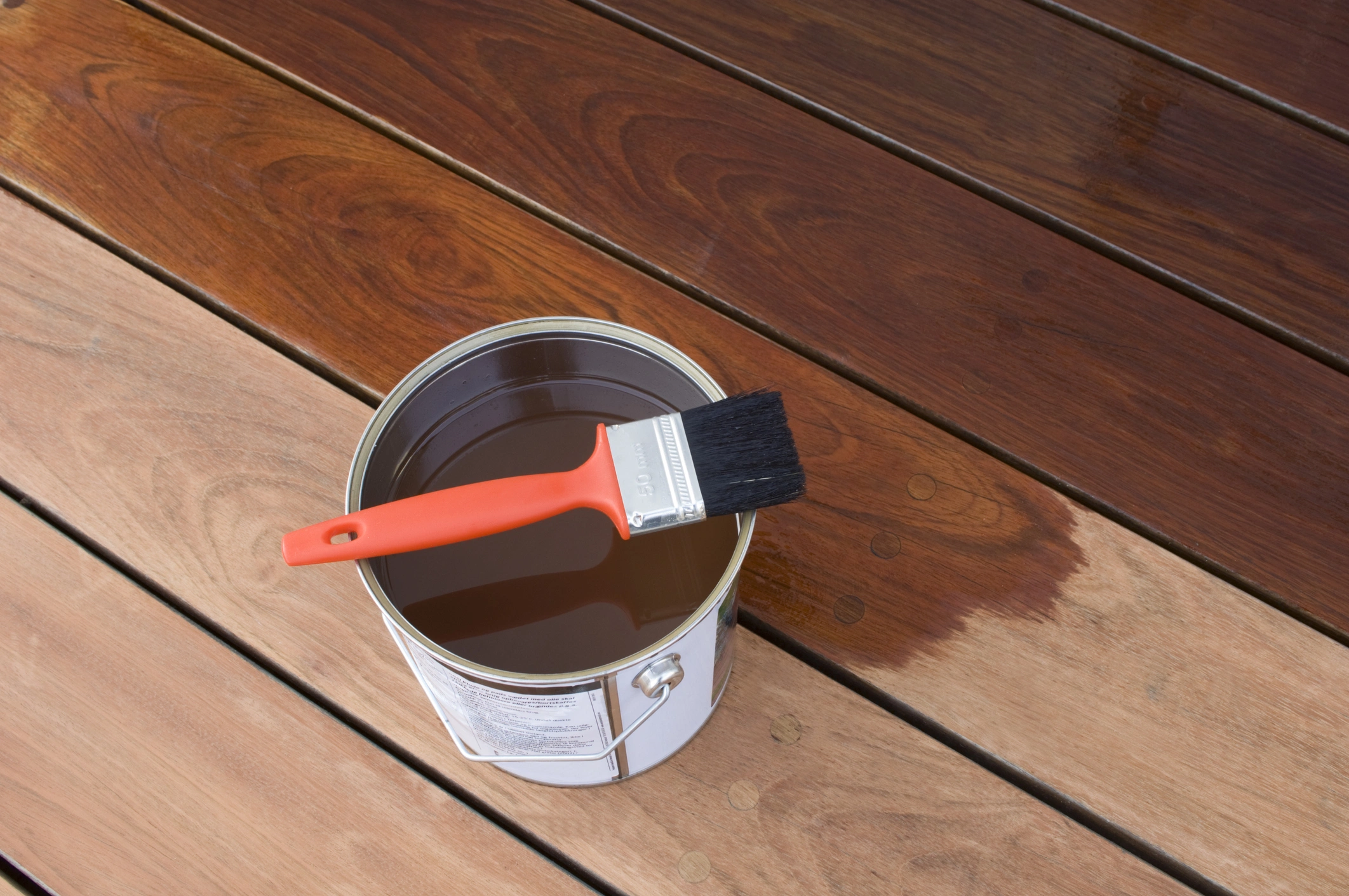 Vanish being used to paint over the timber wooden deck to maintain it's colour, and also make it more shiny and colourful. 