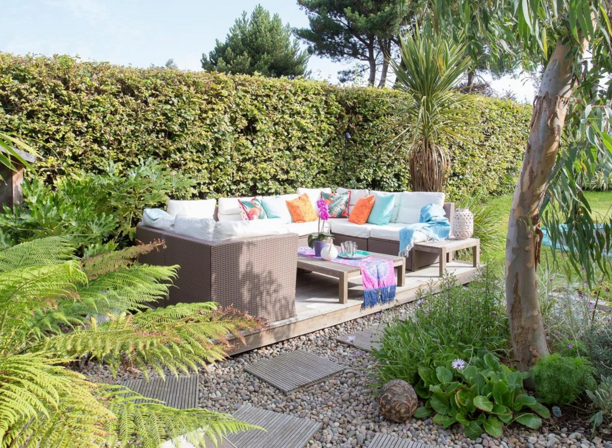 Line timber decking with white gravel or pebbles to achieve a beachy vibe.