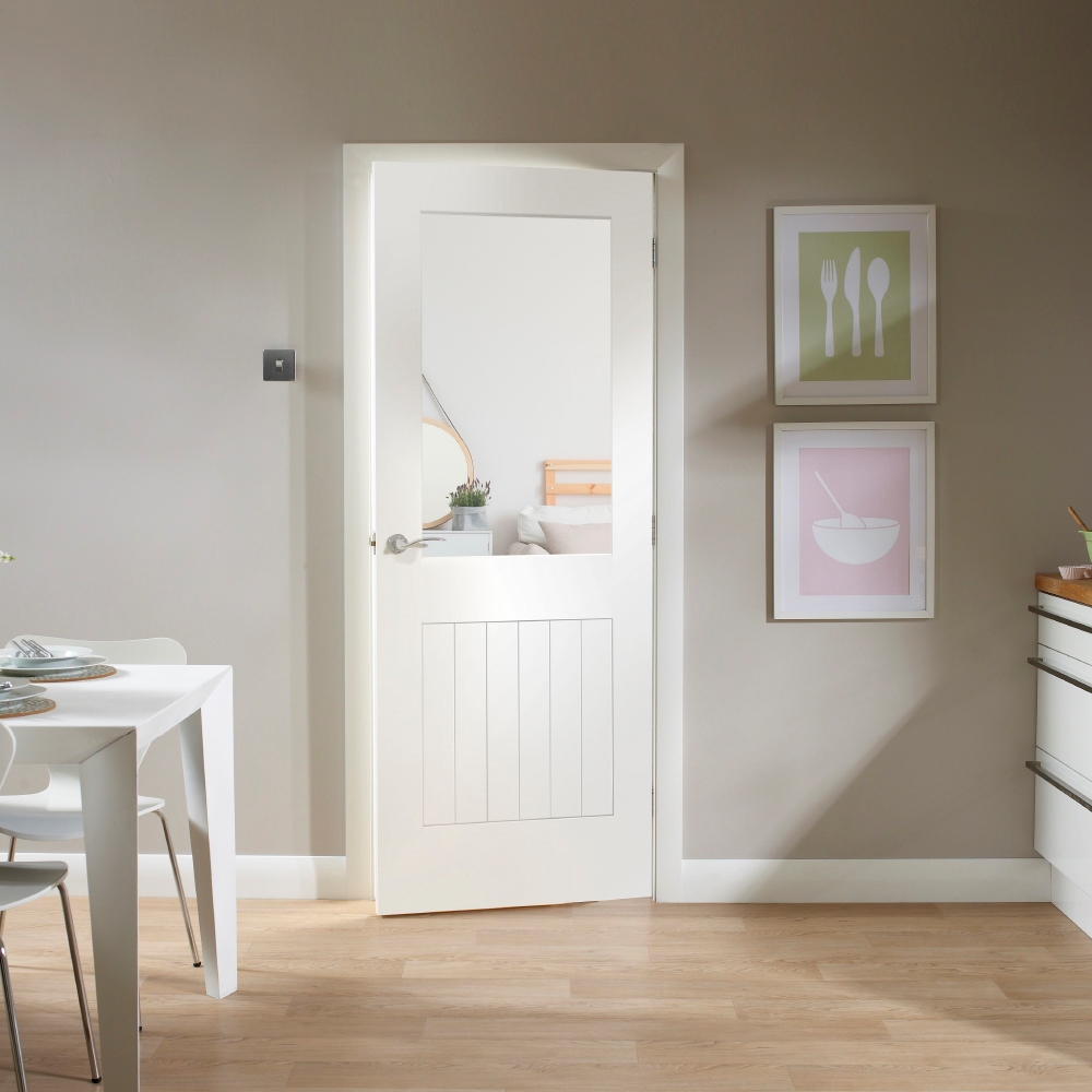 An image showing Suffolk 1 Light Internal a White Primed Door with Clear Glass . Beige walls and wooden laminate flooring.