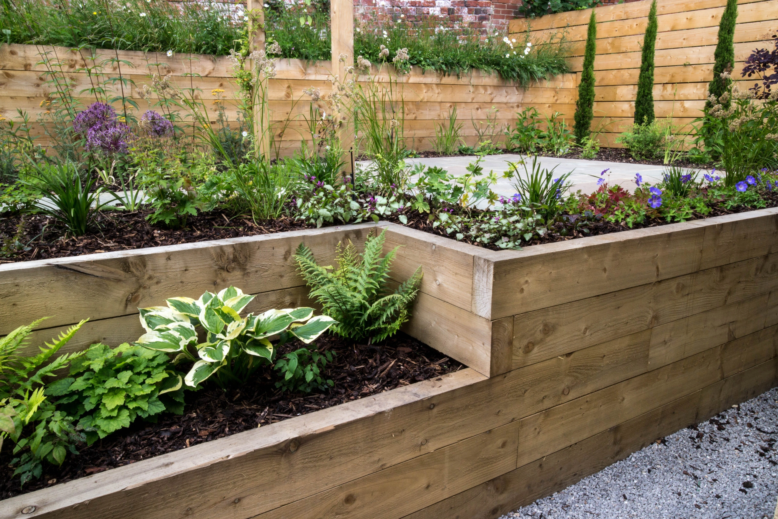 Elevate your garden with raised garden sleepers, adding dimension and style to your outdoor space.