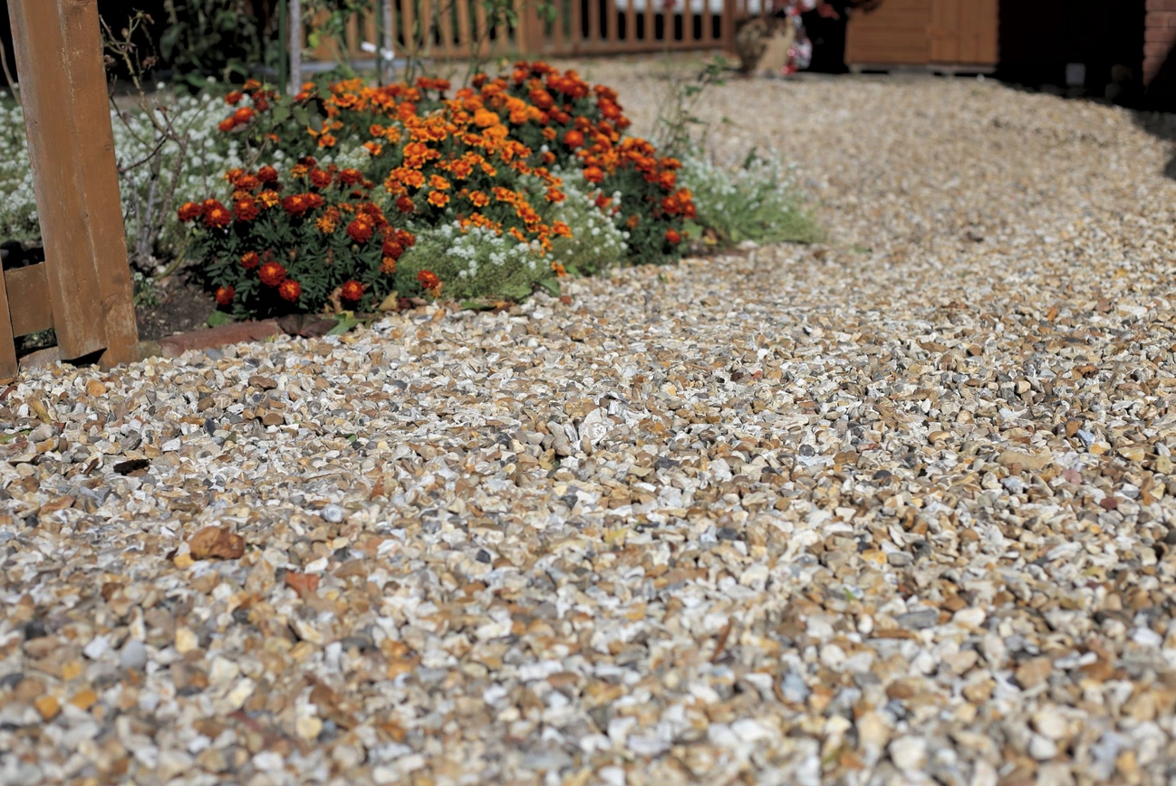 Gravel driveways can be completed with the addition of edging, which can be used with timber sleppers and stone blocks.