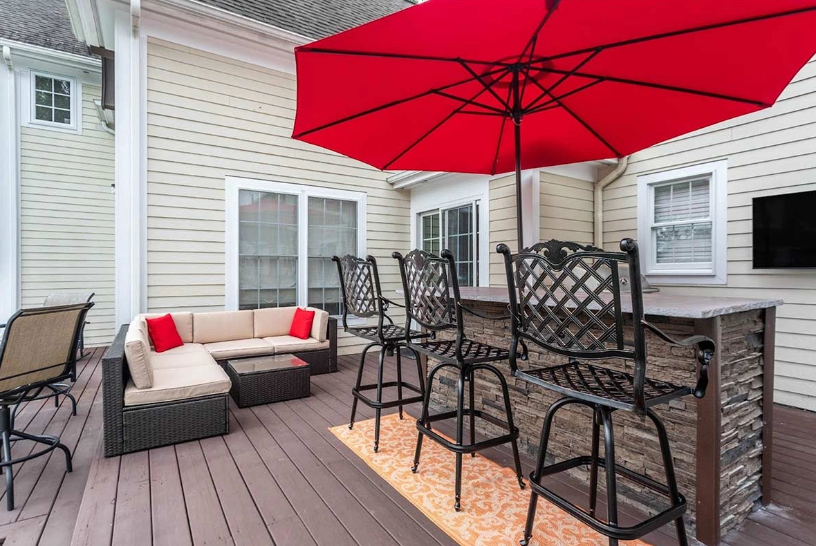 A garden bar placed on decking is a great set up, and is ideal for small gardens.