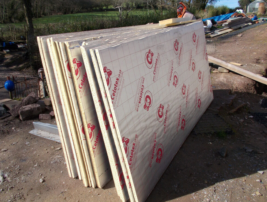 an image of a celotex insulation boards amongst mud