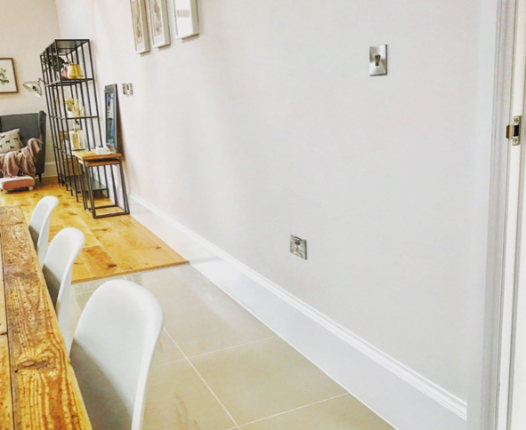 an image of a bright white wall with white skirting boards