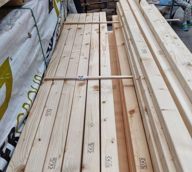 CLS Timber slants lined up outside a building site to be used for a project. 