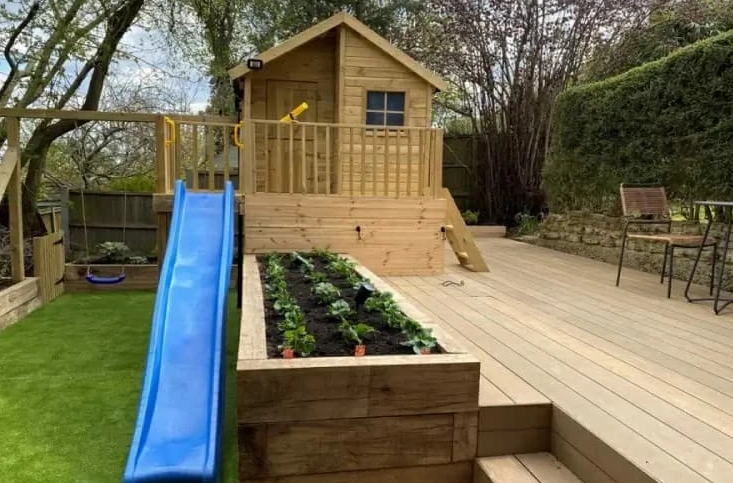 Use garden decking to design a child-friendly play area to make the most of space whilst keeping things safe and stylish.