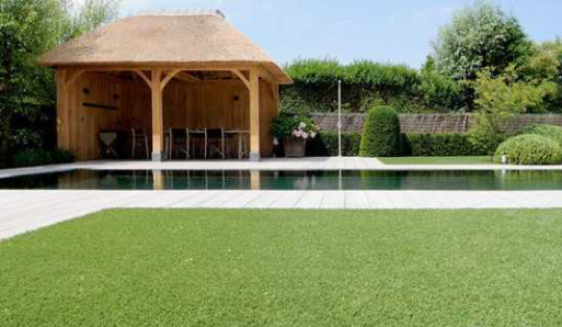 a scenic image of a gondola and pool with artificial grass