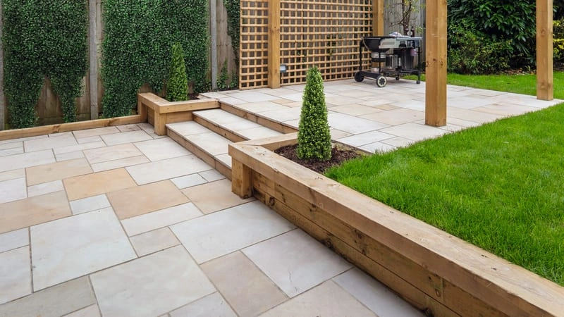 Charming paving design nestled within a cozy small garden, adding character and functionality to outdoor space. 