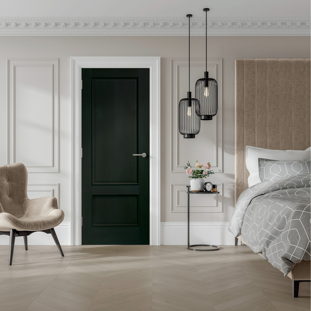 An image showing the Andria Internal Americano Black Oak Door in a beige bedroom. Beige stone laminate herringbone flooring, grey bed to the right.