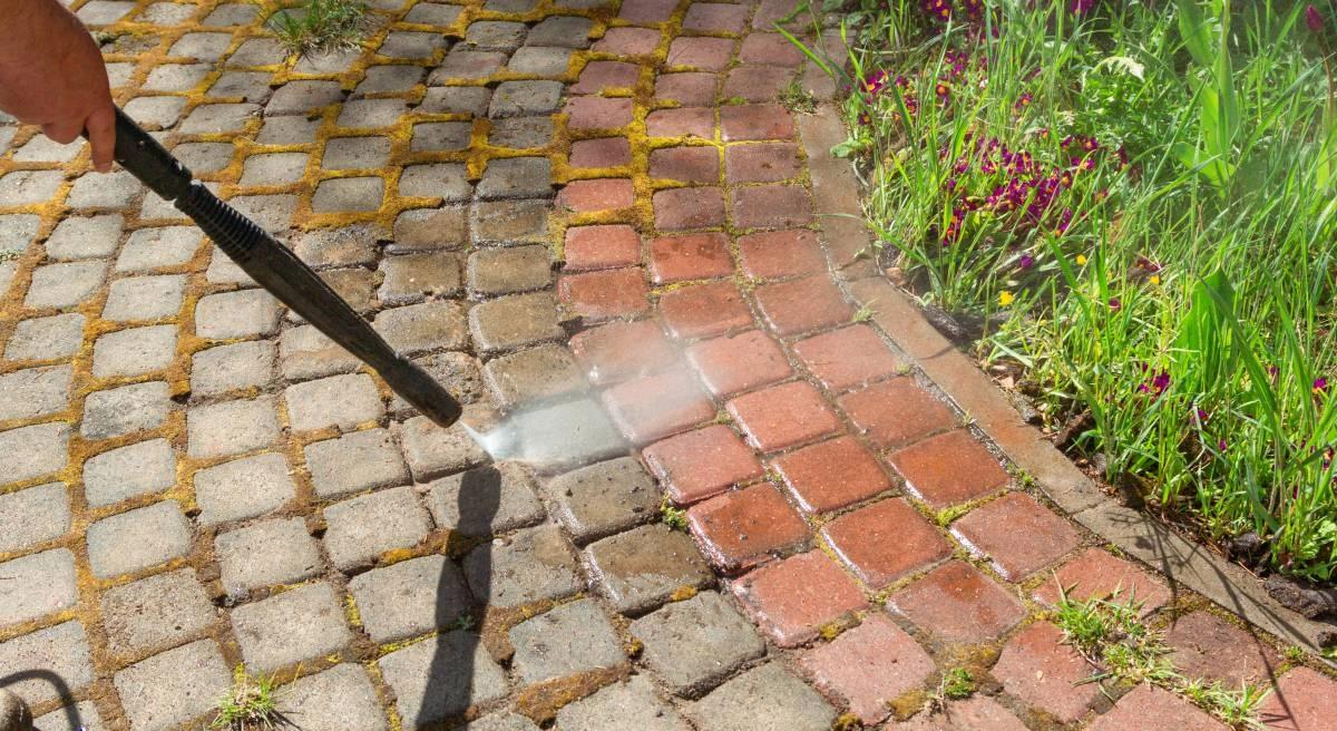 Pressure washer effectively removes dirt and grime from garden stones, restoring their natural beauty with ease.